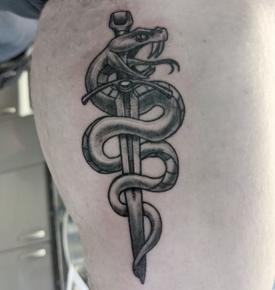 Grey Shaded Snake and Dagger Hip Tattoo