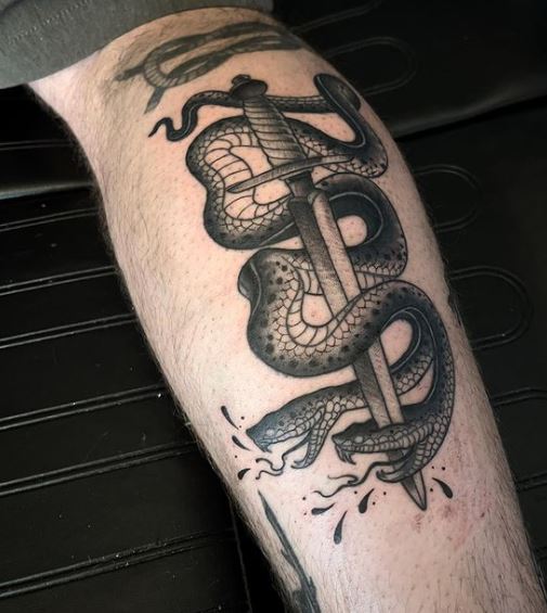 Black and Grey Two Headed Snake and Dagger Calf Tattoo