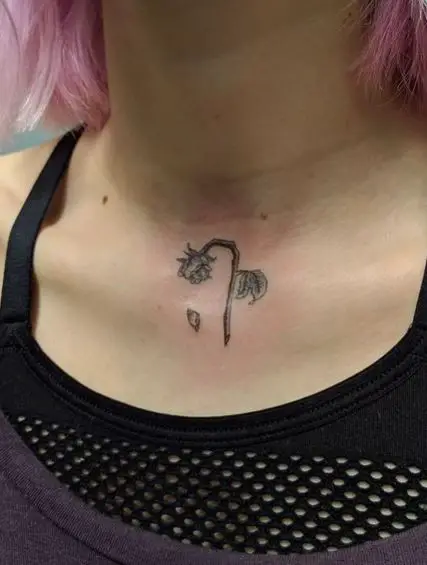Minimalistic Dead Rose and Fallen Petal Chest Tattoo