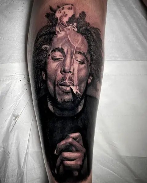 Black and Grey Bob Marley Smoking Joint Tattoo