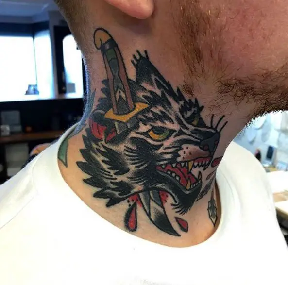 Stabbed Wolf's Head Neck Tattoo