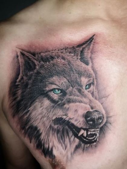 Snarling Wolf with Green Eyes Chest Tattoo
