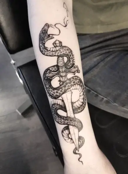 Grey Shaded Snake and Dagger Forearm Tattoo
