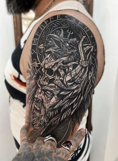 Man with Beard and Helmet with Horns and Skull Arm Tattoo