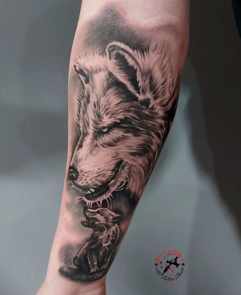 Black and Grey Wolf and Cub Forearm Tattoo