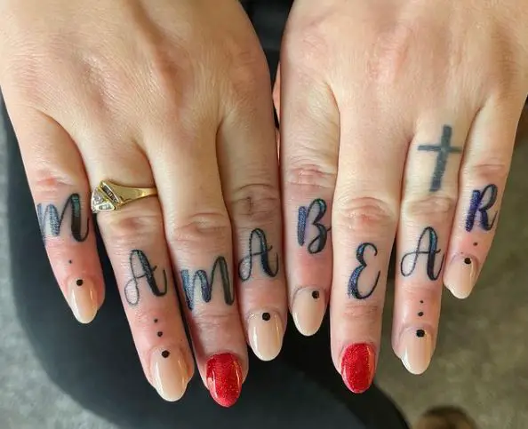 Cross and Lettering Knuckles Tattoo