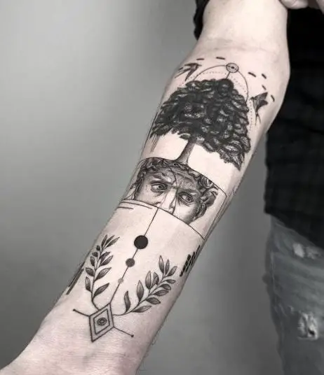 Face with Tree and Laurel Branches Forearm Tattoo