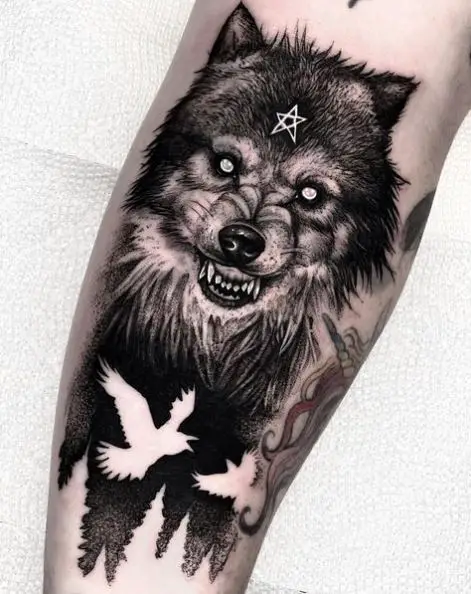 White Birds and Snarling Wolf Arm Tattoo