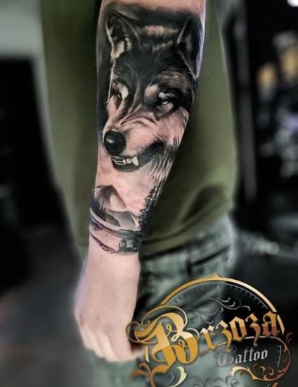 Mountain and Angry Wolf Forearm Tattoo