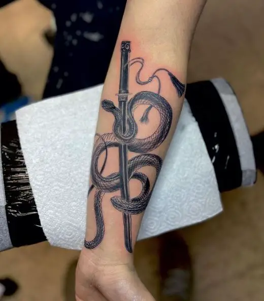 Black and Grey Snake and Sword Forearm Tattoo