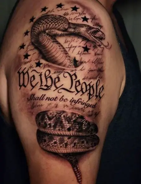 Rattlesnake and We The People Arm Tattoo