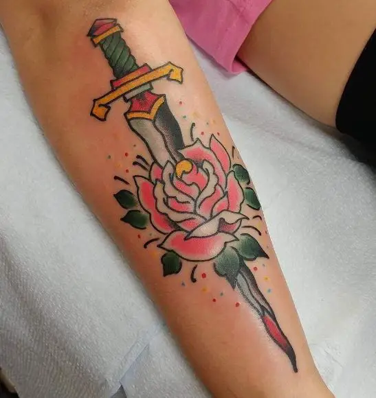 Dagger and Dying Pink Rose Forearm Tattoo
