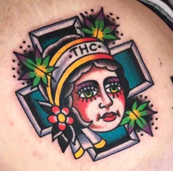 Nurse with Flower and Marijuana Leaves Tattoo