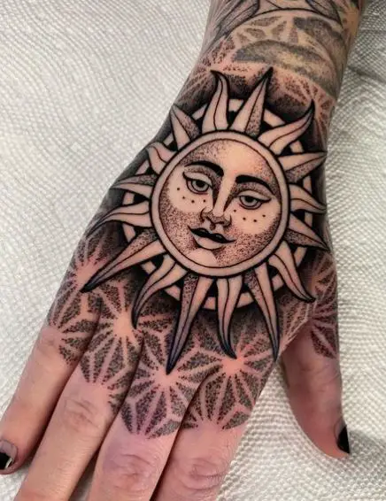 Sun with Face Hand to Knuckles Tattoo
