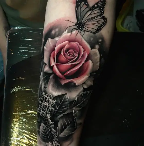 Butterfly and Pink Rose Forearm Tattoo