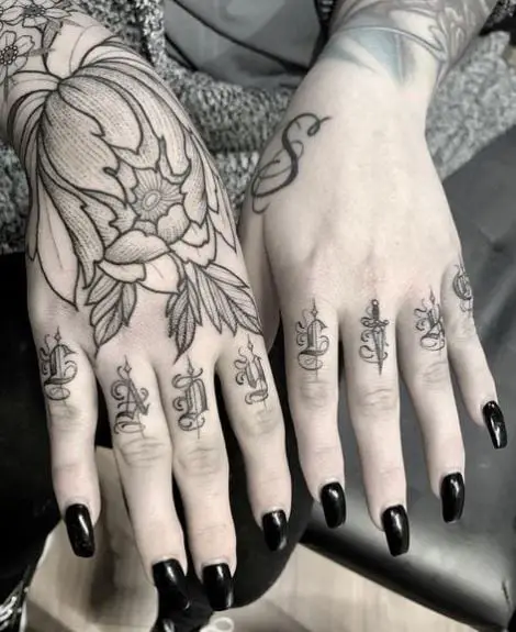 Chrysanthemum and Lettering Hand to Knuckles Tattoo