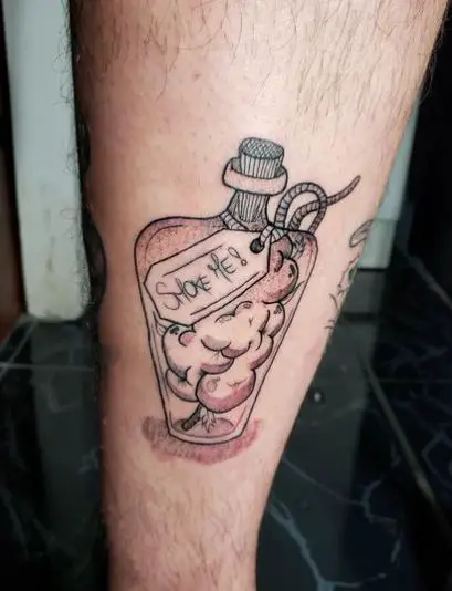 Bottle with Weed Buds Leg Tattoo