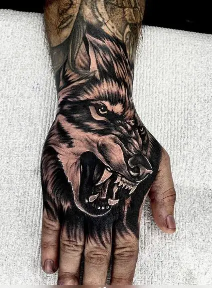 Black and Grey Angry Wolf Hand Tattoo
