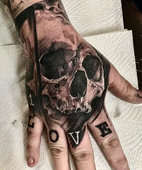 Skull and Letters Hand to Knuckles Tattoo