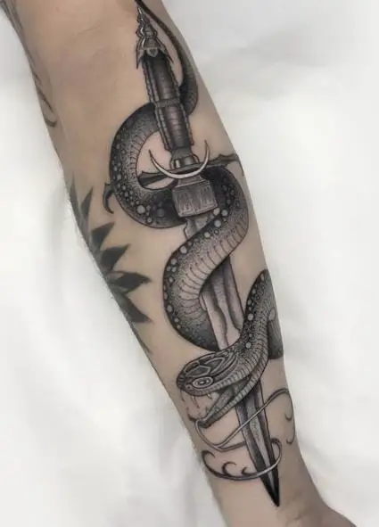 Black and Grey Snake and Sword Forearm Tattoo