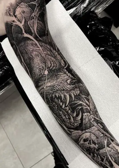 Skull and Snarling Wolf Arm Sleeve Tattoo