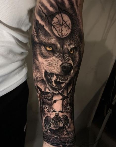 Dark Forest and Snarling Wolf Arm Sleeve Tattoo