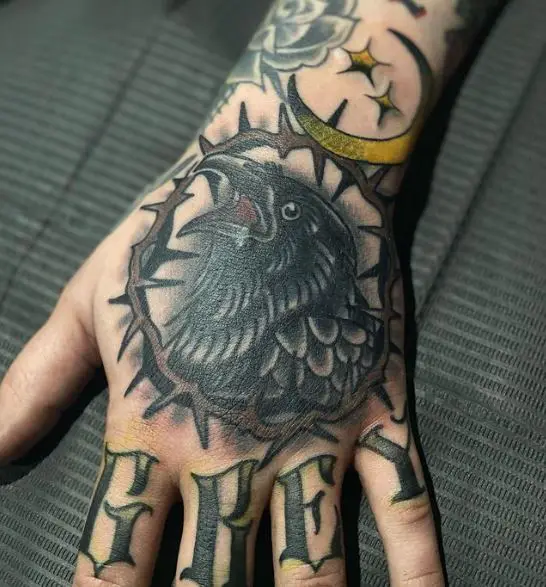 Crow with Thorns and Letters Hand to Knuckles Tattoo