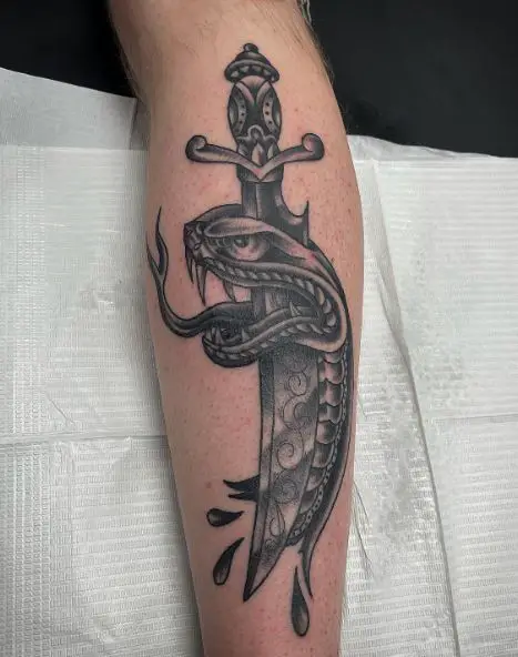 Grey Snake Pierced by Dagger Forearm Tattoo