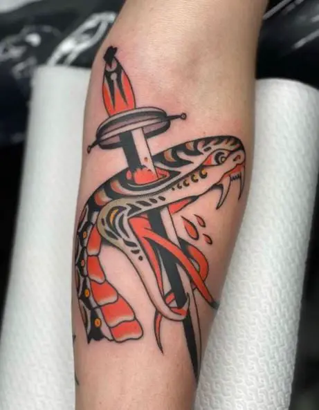 Dagger Piercing Snake Head Arm Tattoo