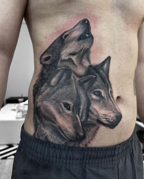 Pack of Wolves Stomach Tattoo