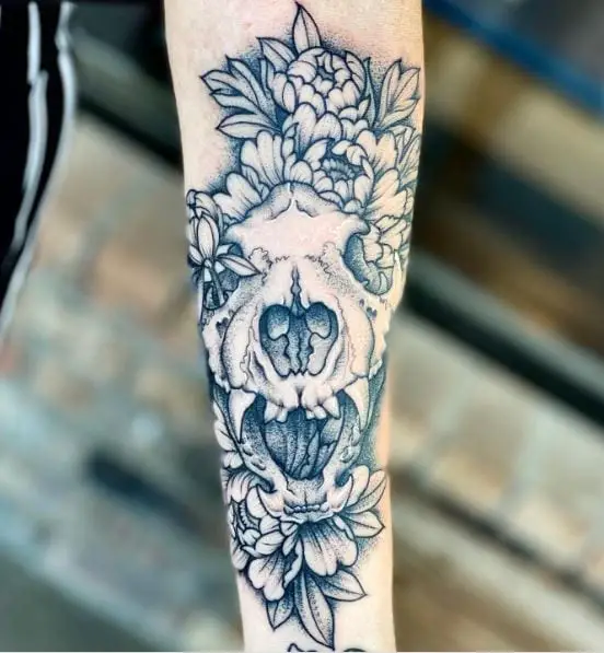 Flowers and Wolf Skull Arm Tattoo