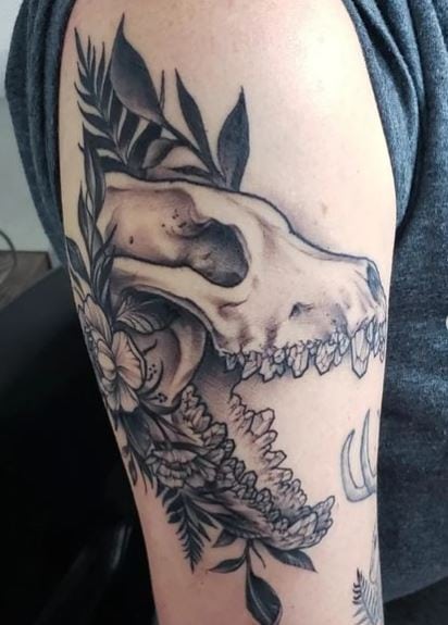 Flowers with Leaves and Wolf Skull Arm Tattoo