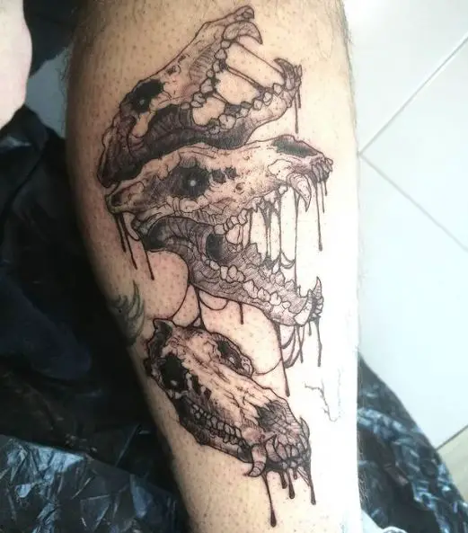 Snarling Wolf Skulls Leg Tattoo
