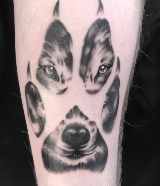 Black and Grey Wolf Paw Tattoo