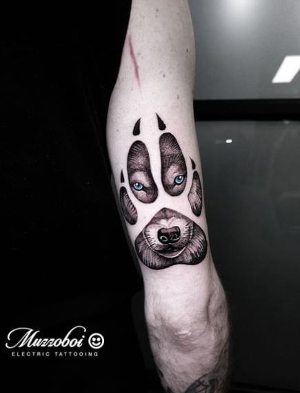 Black and Grey Wolf Paw Arm Tattoo