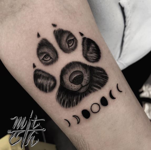 Moon Phases and Wolf Paw Forearm Tattoo