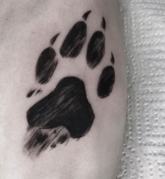 Black Shaded Wolf Paw Tattoo