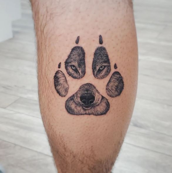Wolf Paw with Eyes Leg Tattoo