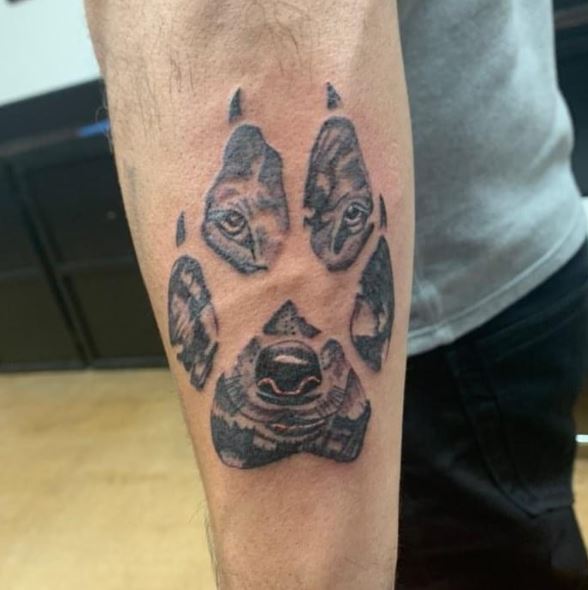 Black and Grey Wolf Paw Forearm Tattoo
