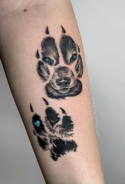 Blue Heart and Wolf Paws Forearm Tattoo