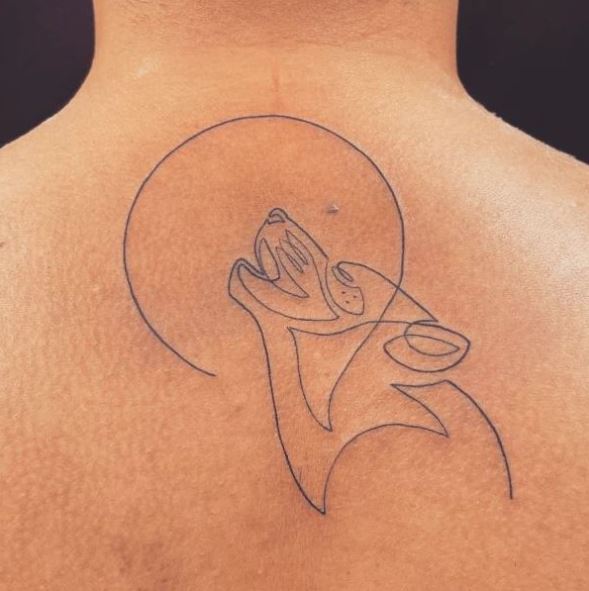 Minimalistic Moon and Wolf Spine Tattoo