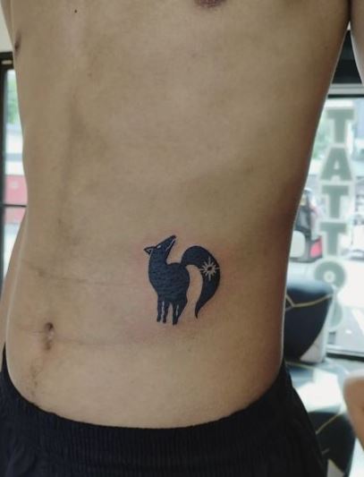 Minimalistic Black Wolf Stomach Tattoo