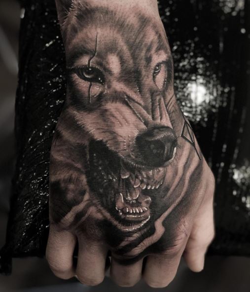 Black and Grey Snarling Wolf Hand Tattoo