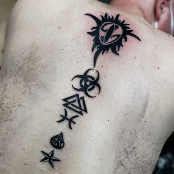 Small Nautical Star Back Tattoo with Different Symbols