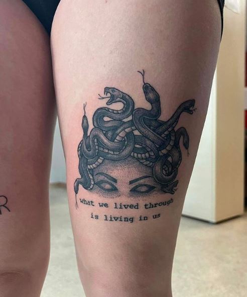 Black and Grey Eye Level Medusa Thigh Tattoo