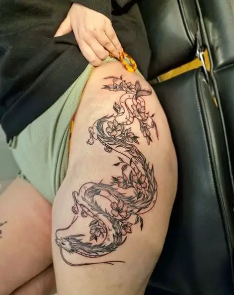Black and Grey Floral Dragon Thigh Tattoo