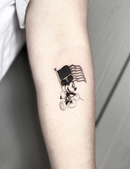 Black and Grey Mickey Mouse with a Flag Tattoo