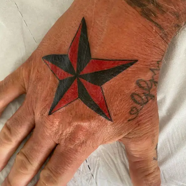 Black and Red Nautical Star Hand Tattoo