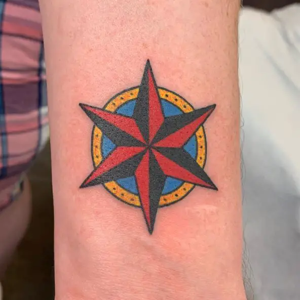 Black and Red Nautical Star with Blue and Yellow Circle Tattoo