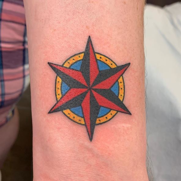 Black and Red Nautical Star with Blue and Yellow Circle Tattoo